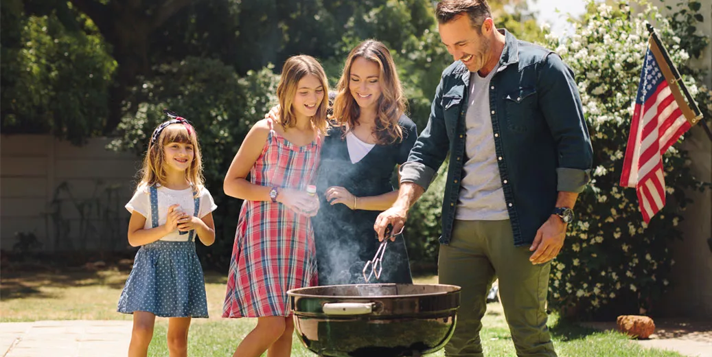 Family grilling outside