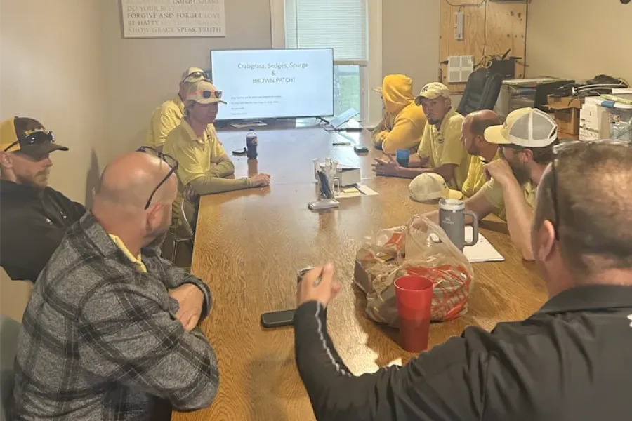 Tailor Made Lawns crew in a lawn care training and safety meeting