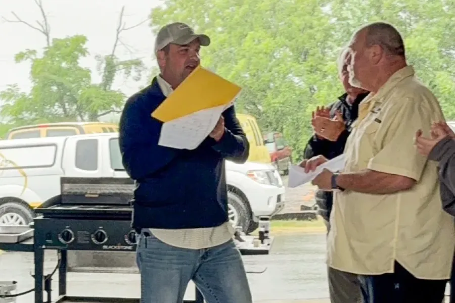 Tailor Made Lawns leader addressing the team at an outdoor company event