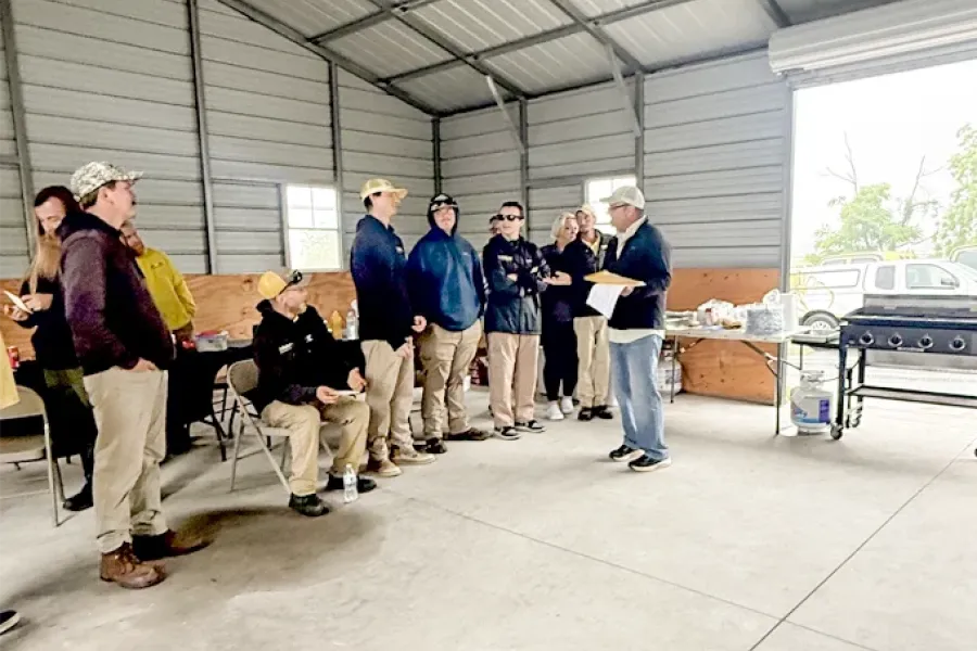 Tailor Made Lawns team gathered together for a company event