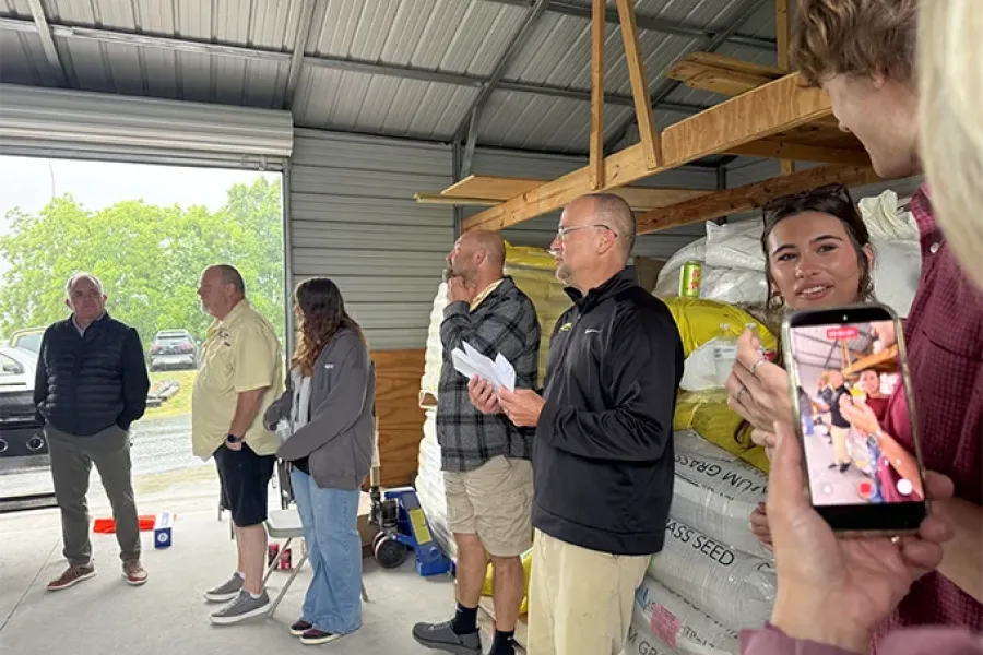 Tailor Made Lawns team gathered for a meeting during a company BBQ