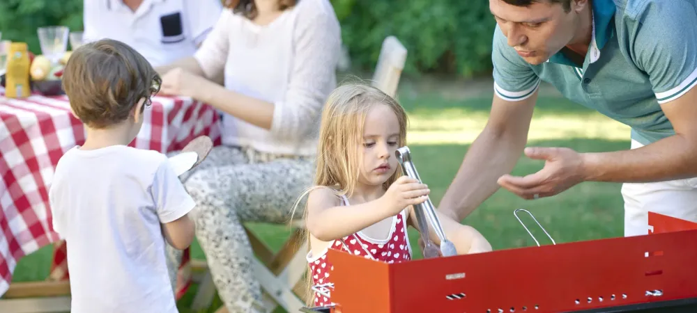 Family enjoying backyard barbecue