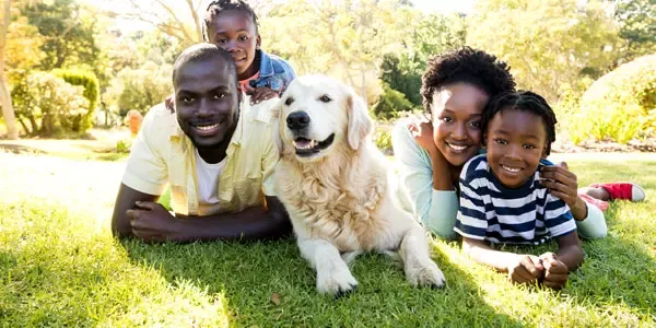 Family outside with dog