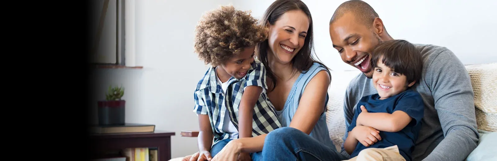 Family laughing in living room
